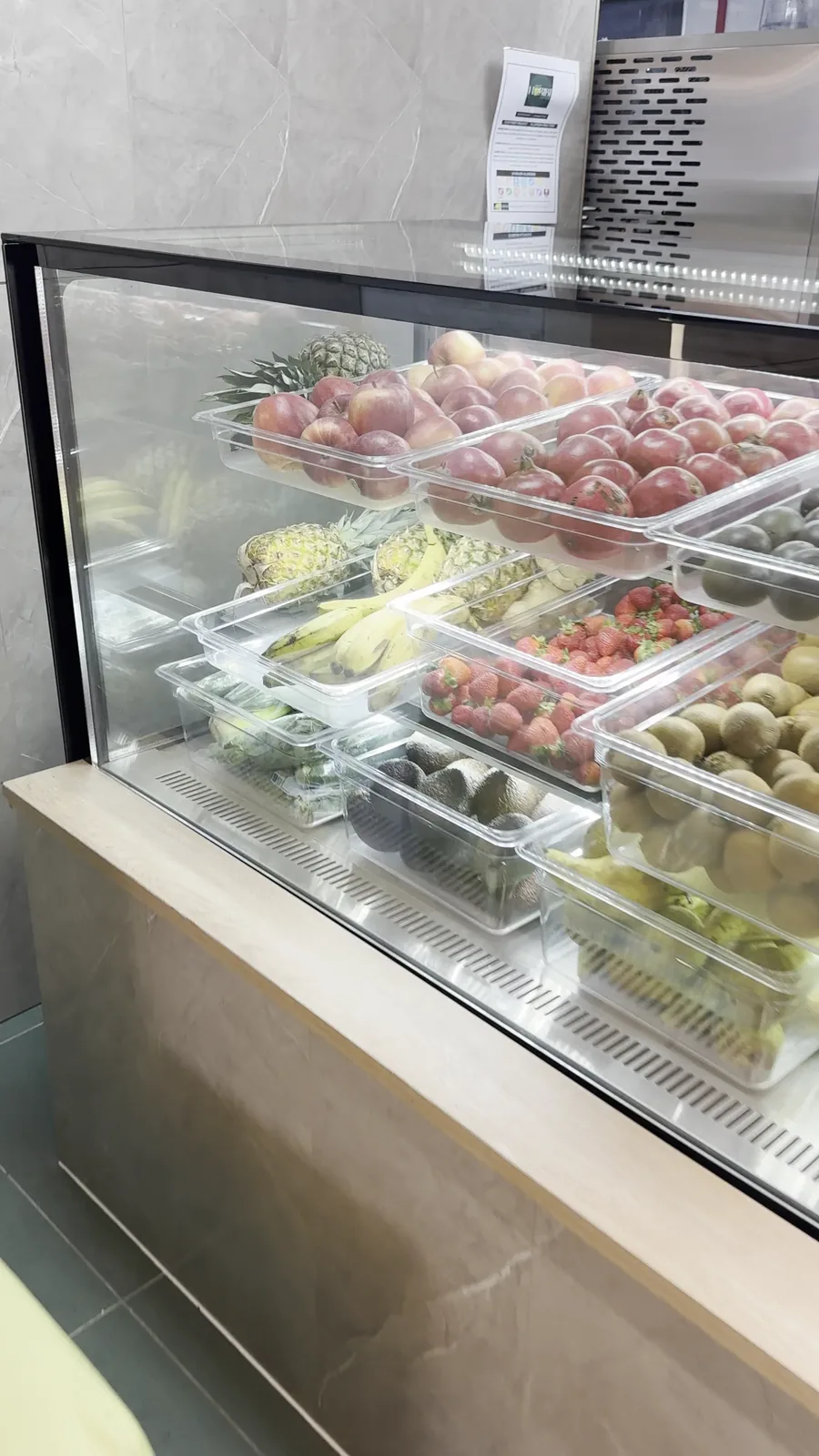The chilled fruit and dessert counter inside Habibi Juice.