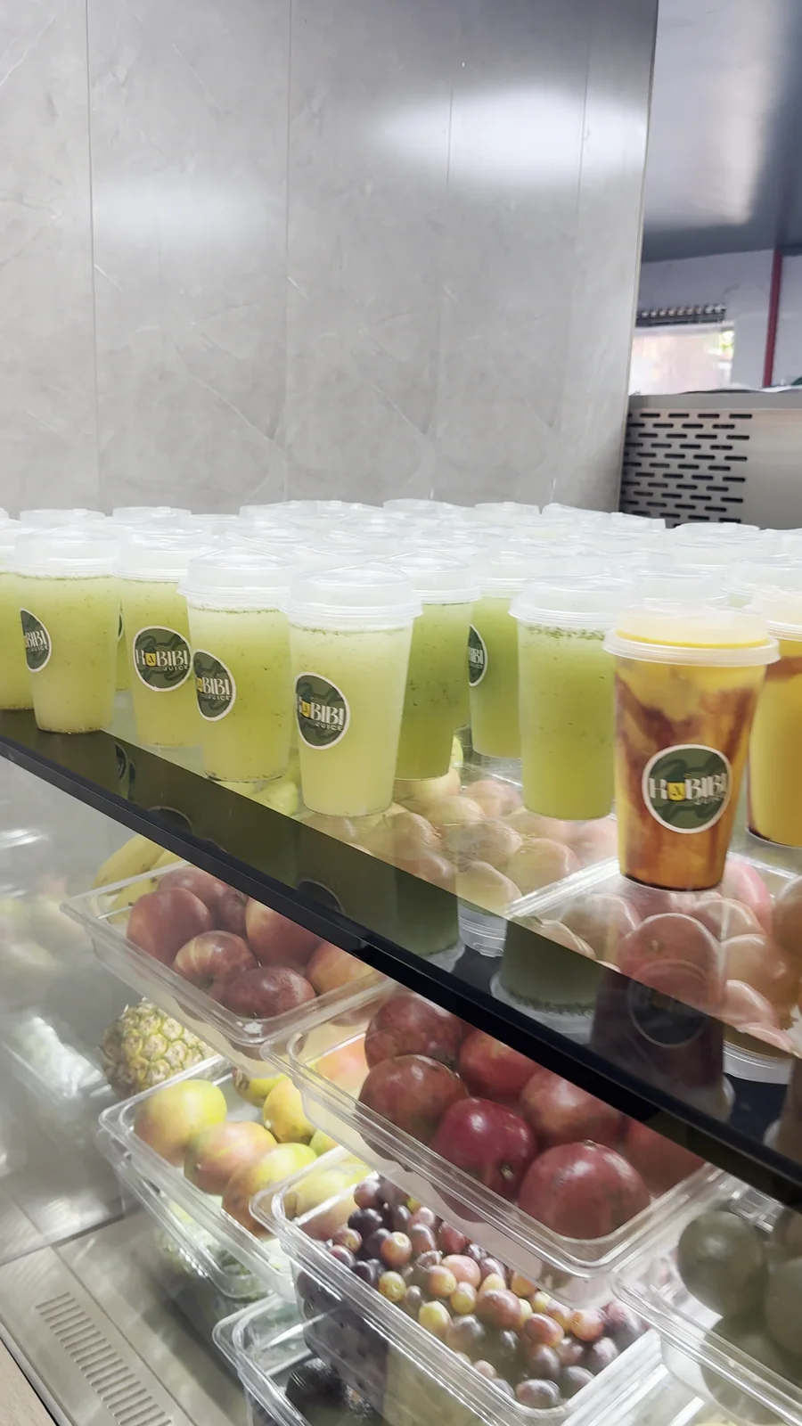 A row of freshly prepared Habibi Juice drinks at the counter.